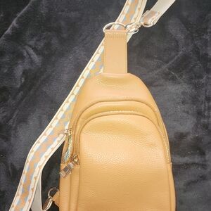 Chic Tan Crossbody Bag with Patterned Strap